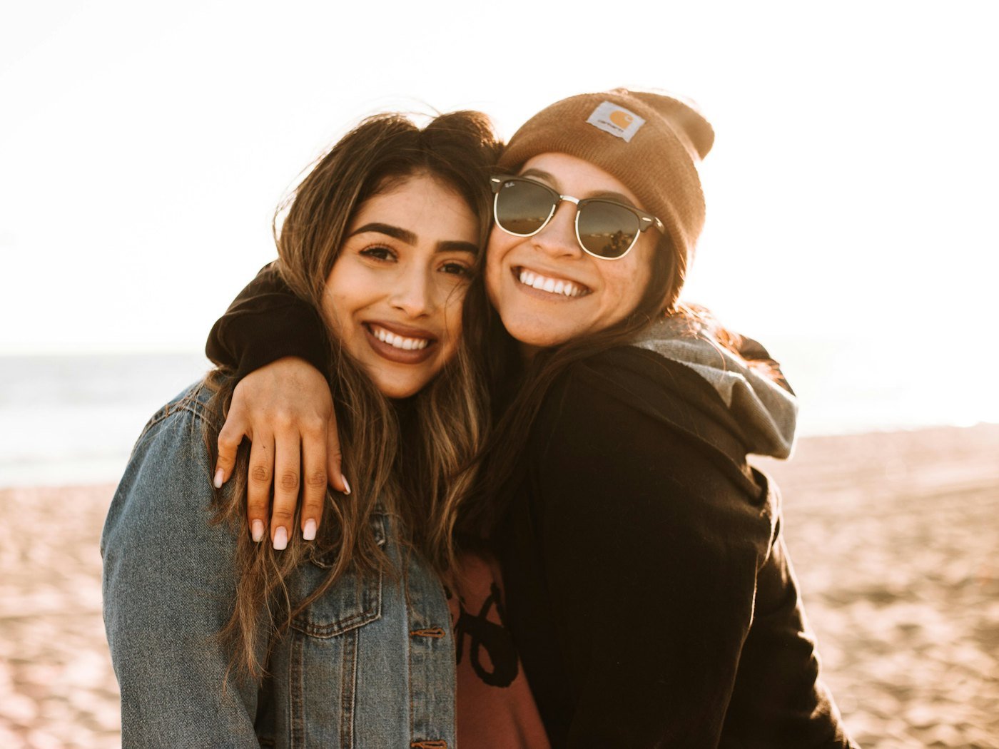 Two friends embracing and laughing